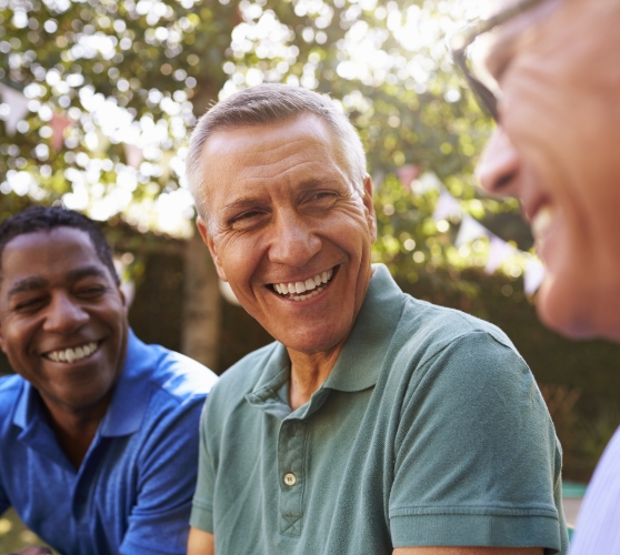 Group of men laughing together outdoors